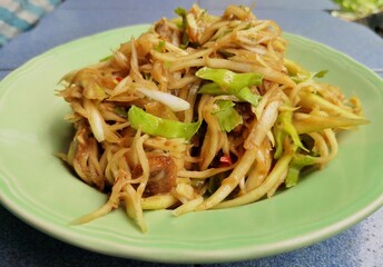 Thai food, papaya salad in the dish.