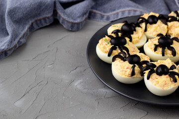 Deviled Eggs With A Spider For Halloween Party.