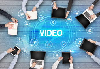 Group of people having a meeting with VIDEO insciption, social networking concept