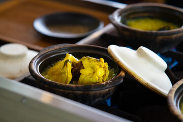 Ikan patin masak tempoyak is one of the famous dish in Pahang, Malaysia. Baung fish cooked in claypot, a unique cooking style with fermented durian.