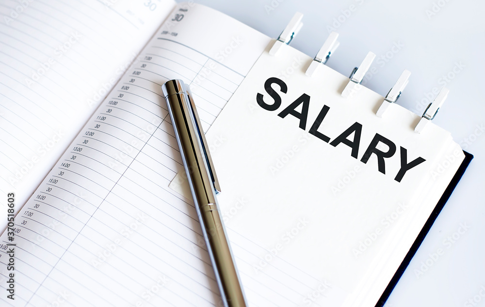 Poster text salary on the short note texture background with pen