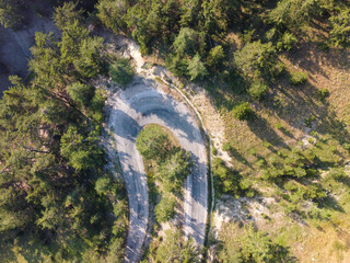 Aerial drone view of U Turn Road Curve in forest