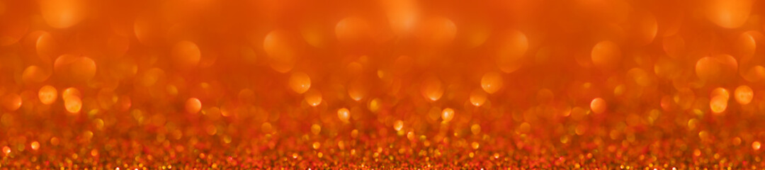 Panorama orange glitter bokeh background