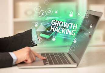 GROWTH HACKING inscription on laptop, internet security and data protection concept, blockchain and cybersecurity