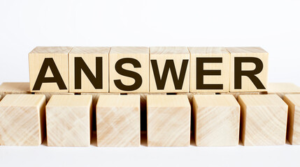 ANSWER word from wooden blocks on desk, search engine optimization concept