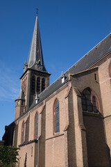 Fototapeta na wymiar Roman Catholic Saint Willibrord Church in water sports town Lemmer, the Netherlands