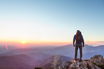 Fototapeta premium Hiker on the top of the mountain, landscape view