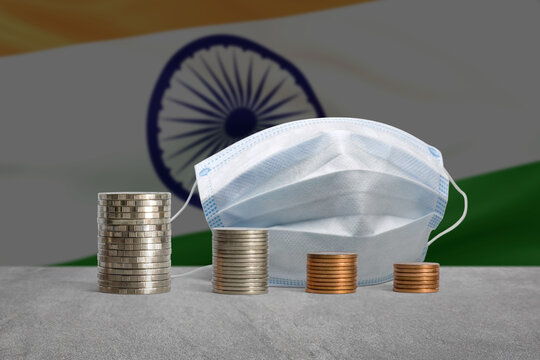 Stacks of coins in a decrease financial from COVID-19 crisis in India. - Powered by Adobe