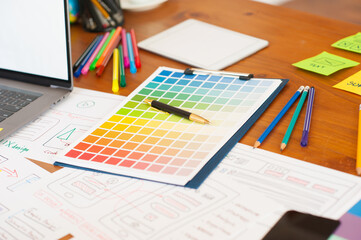 Naklejka na ściany i meble Color swatch for designing websites and mobile apps on the desk.