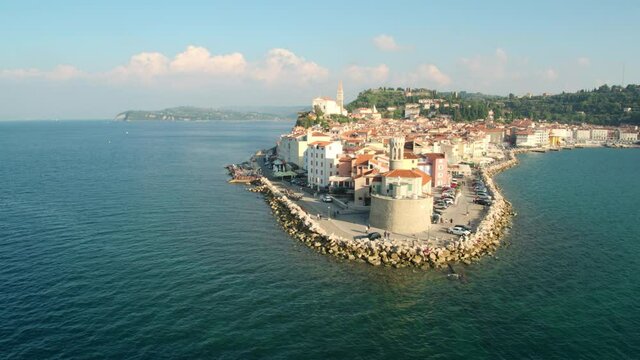 4K Drone Push Back Shot Of A Seaside City On Beautiful Day