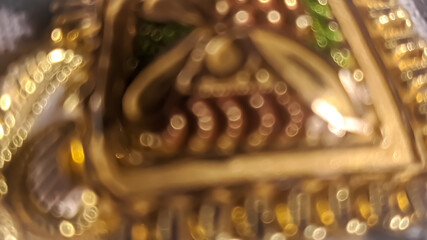 Golden bokeh pattern on yellow dark defocus background.
