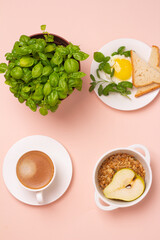 breakfast of eggs, black coffee, granola and basil.