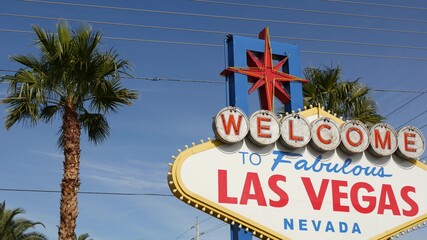 Welcome to fabulous Las Vegas retro neon sign in gambling tourist resort, USA. Iconic vintage banner as symbol of casino, games of chance, money playing and hazard betting. Lettering on signboard