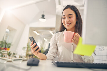 Positive delighted international woman reading income message