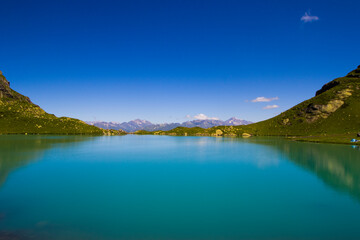 Alpine mountain lake landscape and view, blue beautiful and amazing lake panorama