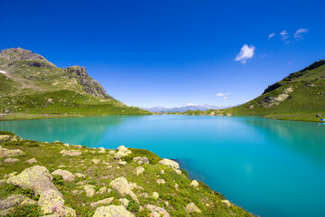 Alpine mountain lake landscape and view, blue beautiful and amazing lake panorama