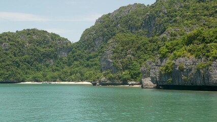 Fototapeta premium Group of Islands in ocean at Ang Thong National Marine Park near touristic Samui paradise tropical resort. Archipelago in the Gulf of Thailand. Idyllic turquoise sea natural background with copy space