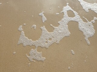 water foam on the sand