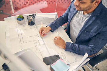 Close up of young man making notes