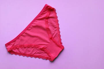 Set of women's panties on a pink background. Pink and blue underwear.