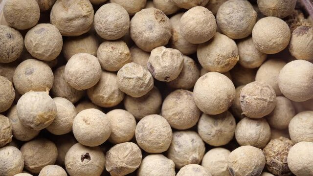 White peppercorn background. Slow rotation.