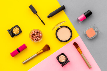 Beauty cosmetics and makeup products on colorful background. Flat lay, top view