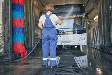 Silhouette of woman that working at the carwash