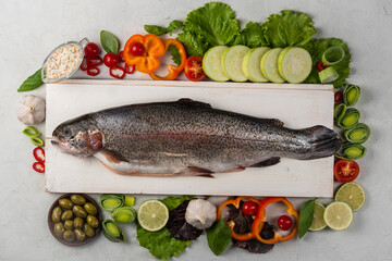 Carcass trout fish prepared baking dish with vegetables and spices
