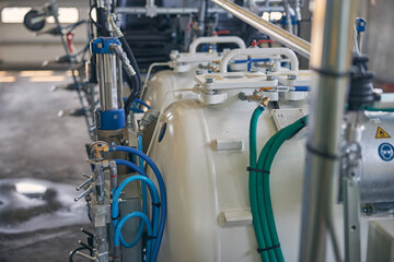 Big white barrels standing in one line