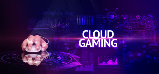 hand holding wireless peripheral with CLOUD GAMING inscription, modern technology concept