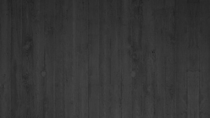 Grunge black anthracite dark concrete wall texture background, with wooden boards structure
