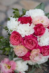 festive bouquet of pink-white with wedding rings
