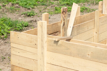 Wooden casing for concrete strip foundation of a new house in Russia (selective focus)