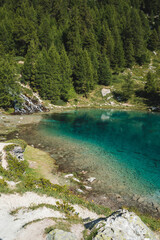 Fototapeta na wymiar Blue lagoon in Switzerland mountains, Valle Verzasca, Lac Bleu