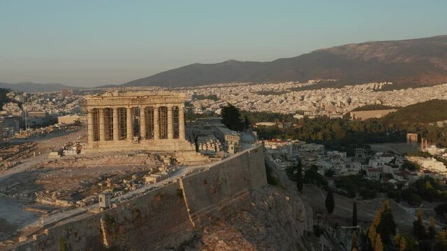 Acropolis of Athens in Construction during beautiful Golden Hour in Summer Aerial