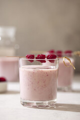 Alcoholic drink with raspberries. Milkshake with berries for decoration