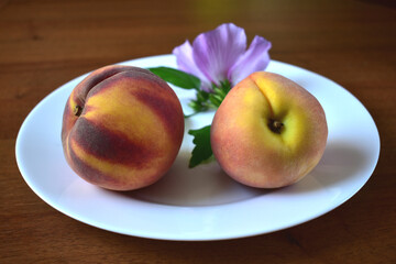 fresh peaches on a plate
