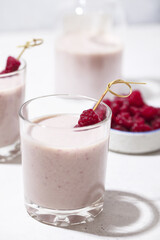 Alcoholic drink with raspberries. Milkshake with berries for decoration