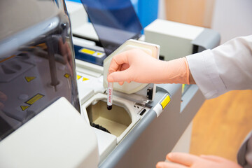 Nurse holding test tube with blood for 2019-nCoV analyzing. Novel Chinese Coronavirus blood test Concept.