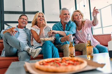 Senior friends having fun at home