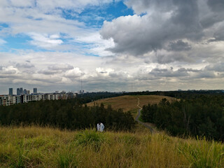 Beautiful view of a park with dark stormy clouds in the sky, Millennium parklands, Newington,...