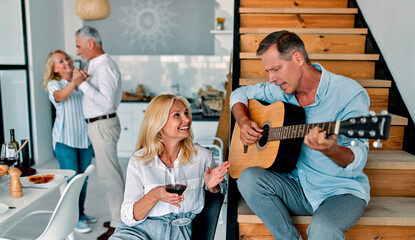 Senior friends having fun at home