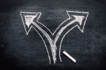 Two direction arrows as concept of choice and making decision