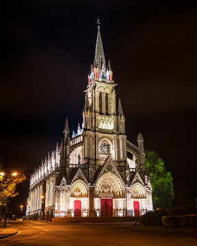 Night view of Basilica of Our Lady of Refuge in Rouen. First church in France to be built in the Gothic Revival style.