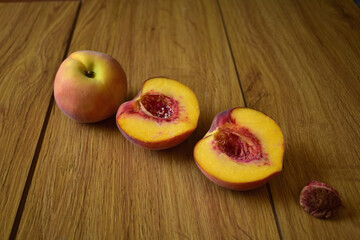Naklejka na ściany i meble ripe peach on wooden table