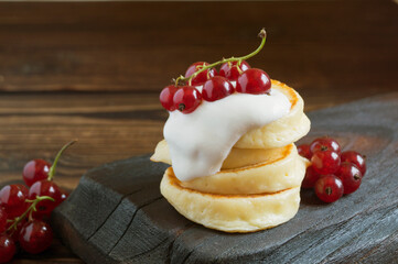 Cottage cheese pancakes, syrniki with fresh berries.