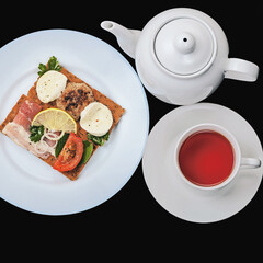 hearty delicious toast with black tea on a dark background for breakfast