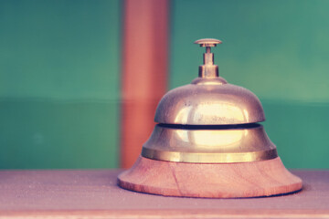 Vintage table bell made of yellow metal, close up