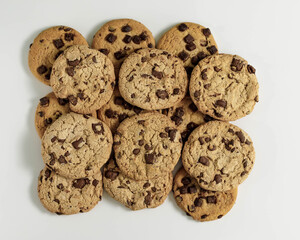 Top view of home made chocolate cookies aligned on a white background