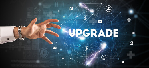 Hand pointing at UPGRADE inscription, modern technology concept